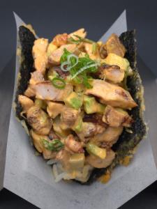 sushi rice, chicken, avocado, cucumber, cilantro, onion, maya sauce, vallarta sauce, green onion Cyclone Taco