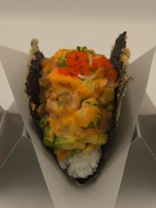 sushi rice, tuna, salmon, avocado, cucumber, masago, sweet sauce, spicy creamy sauce, sesame oil, sriracha, green onion Tornado Taco