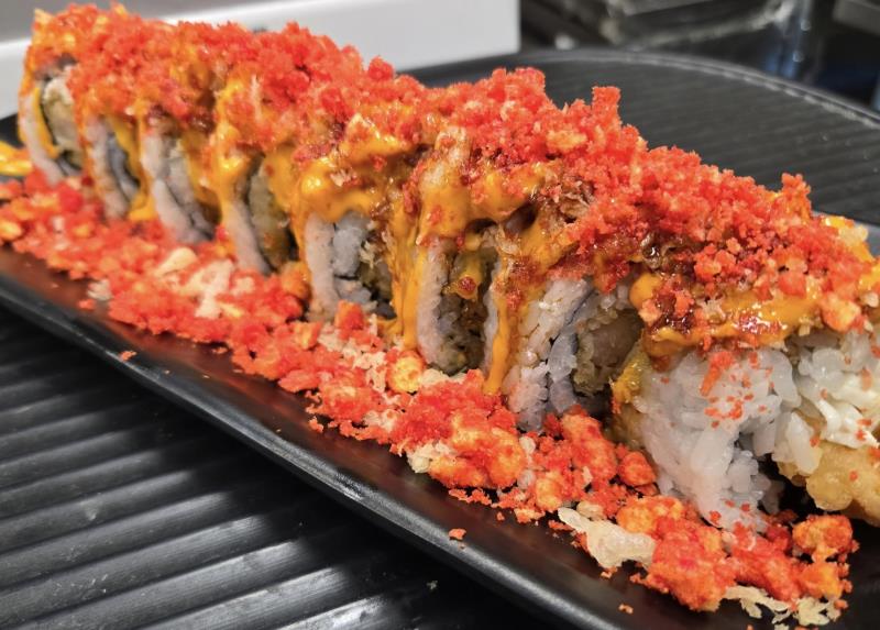 Deep-fried shrimp, crabmeat, and cream cheese. Finished with sweet and spicy mayo sauce. Toped with hot cheetos. Hot Cheetos Roll