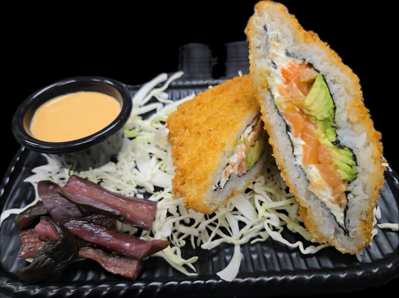 Salmon, Avocado, and Cream Cheese. Deep Fried. Side special spicy sauce and shibazuke (picked eggplant) Sushi Sando