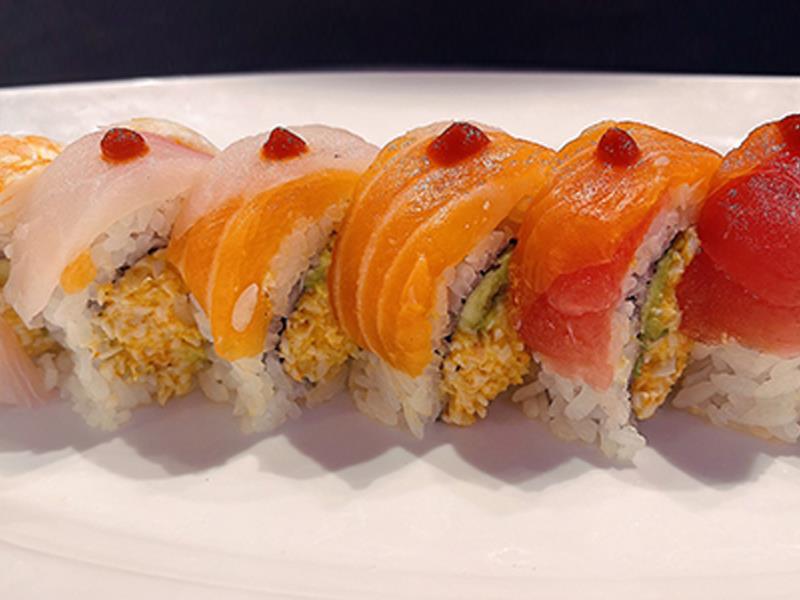 In: Spicy Crab & Avocado
Top: 4 different kinds of Fish including Shrimp, Sriracha Sauce on top Spicy Rainbow