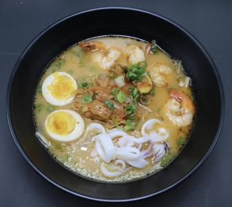 SPICY SEAFOOD RAMEN, DISH SERVED WITH SHRIMP AND CALAMARI, WITH A TONKOTSU (PORK ) BASE BROTH. TOP WITH ZUCCHINI, CABBAGE, ONIONS, BEAN SPROUTS, & GREEN ONIONS. NON SPICY AVAILABLE. Spicy Nagasaki Seafood Ramen