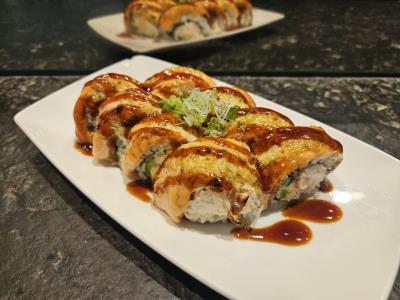 CRAB, AVOCADO, CUCUMBER, SALMON, MISO MAYO, GREEN ONION, EEL SAUCE Baked Salmon Roll
