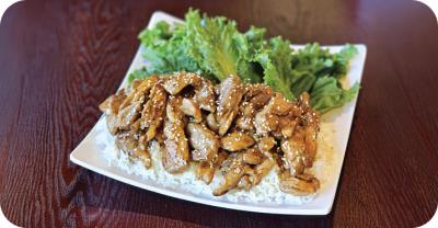 Served on a bed of white rice and with side salad Chicken Teriyaki Meal