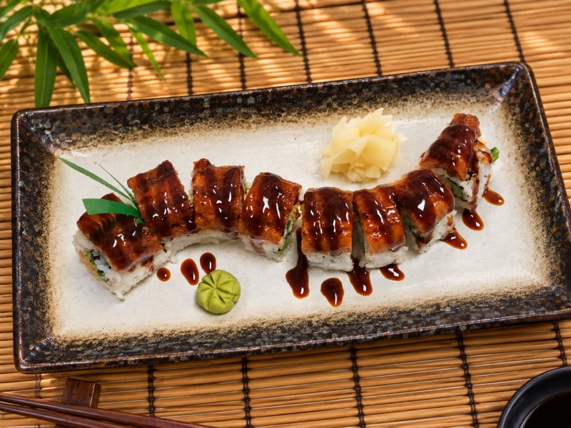 Shrimp tempura roll topped with grilled eel. R25_Super Dragon Roll