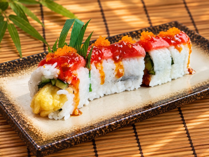 Shrimp Tempura, Avocado,cucumber & red Tuna on top w/ 911 sauce & Masago R31_Red Dragon Roll