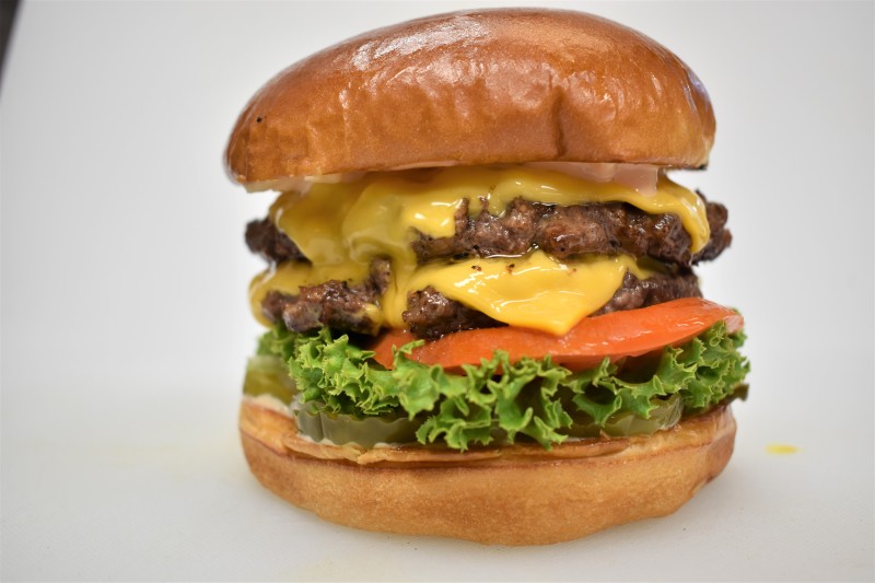 - House sauce, Pickle, Onion, Lettuce, Tomato, American cheese
Double Cheese Burger