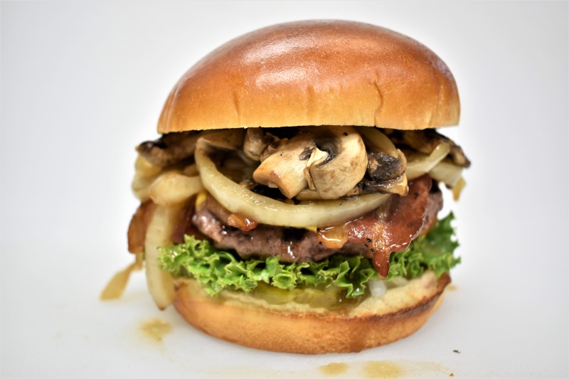 - House sauce, Pickle, Grilled Onion, Grilled mushroom, Lettuce, Tomato, American
cheese
Red Wagon Bacon Cheese Burger