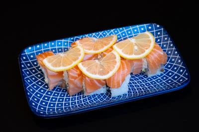 IN: AVOCADO, CRAB MEAT, CUCUMBER
OUT: SALMON, SLICED LEMON
Alaskan Roll