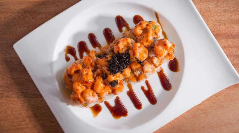 In: Krab & avocado
Top: Seasoned langostine, tobiko & green onion
Sauce: Eel sauce & layu Baked Langostin