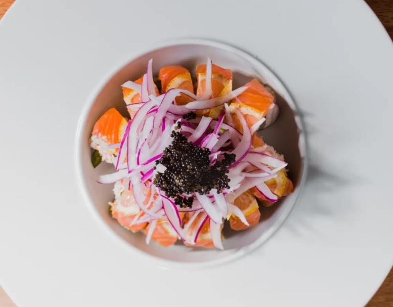 In: Asparagus, Spicy crab meat
Out: Salmon
Top: Sliced lemon, Onion, Garlic ponzu, Black tobiko
 Citrus Salmon