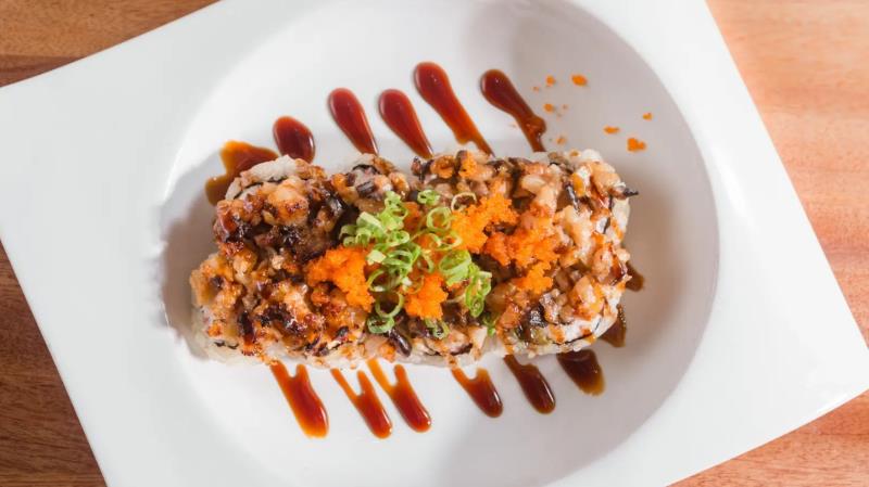 In: Crab meat, Avocado
Out: Chopped Scallop, Shiitake, Ebi (Mayo mix) - Baked
Top: Eel sauce, Masago, Green onion
 Dynamite
