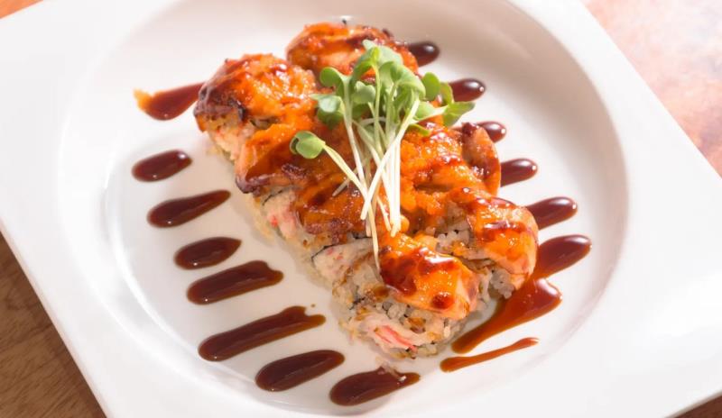 In: Crab meat, Avocado
Out: Salmon with Mayo on top - Baked
Top: Eel sauce, Masago, Kaiware
 Lion King