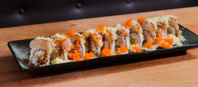 In: Fried shrimp, Crab meat, Avocado
Out: Hotate(scallop) - Seared
Top: Eel sauce, Crunch, Masago
 Mariners Roll