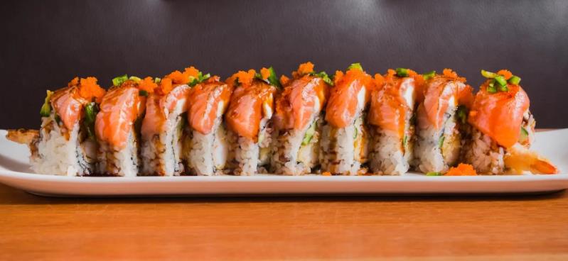 In: Shrimp tempura, krab & avocado
Top: Cream cheese, salmon, masago & chopped jalapeno
Sauce: Eel sauce & house sauce Paradise