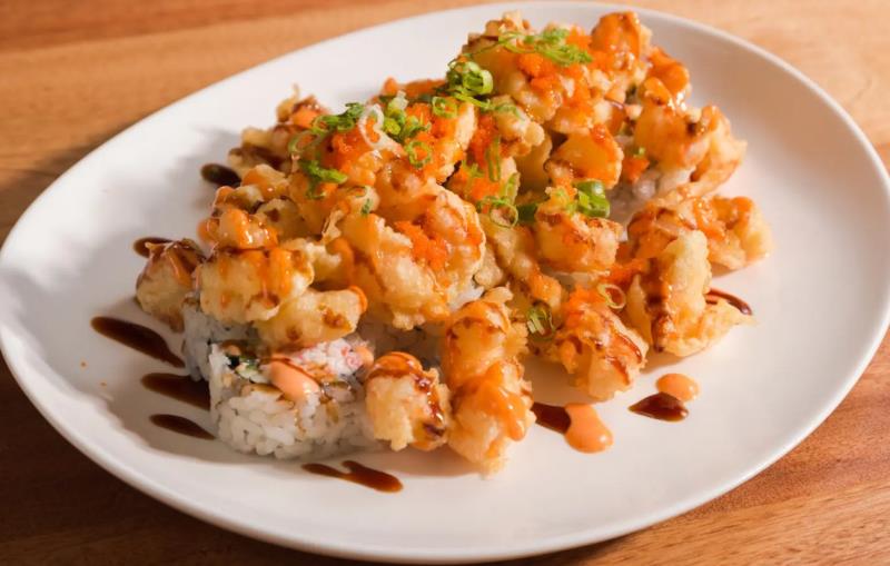 In: Krab, avocado & cucumber
Top: Langostine tempura,masago & green onion
Sauce: Eel sauce & spicy mayo Popcorn