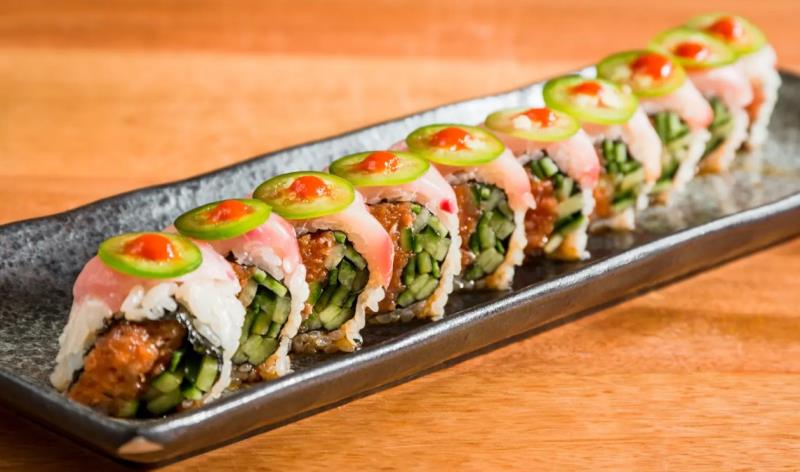 In: Spicy tuna, Cucumber
Out: Hamachi(yellowtail) - Seared
Top: Garlic ponzu, Jalapeno, Sriracha
 Yellow Tail Special