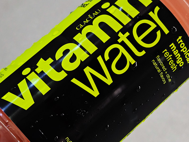 Bottled Tropical Mango flavor Vitamin Water served with Ice Vitamin Water