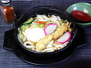 Noodle Soup with shrimp tempura, chicken, fish cake, egg and vegetables. Nabeyaki Udon