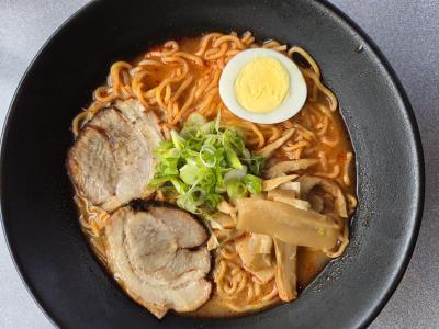 Pork bone broth with a special spicy chili soup. Spicy Tonkotsu Ramen