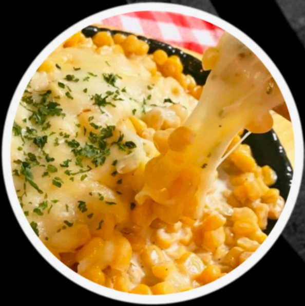SAVORY CORN TOPPED WITH CHEESE.  Corn Cheese