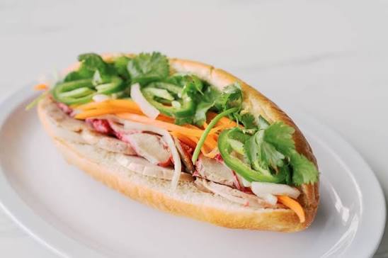 Vietnamese ham and pork cold cuts with house mayo, pickled carrots & daikon, cucumber, cilantro, jalapeno, and scallions. Banh Mi Dac Biet Vietnamese Cold Cuts)
