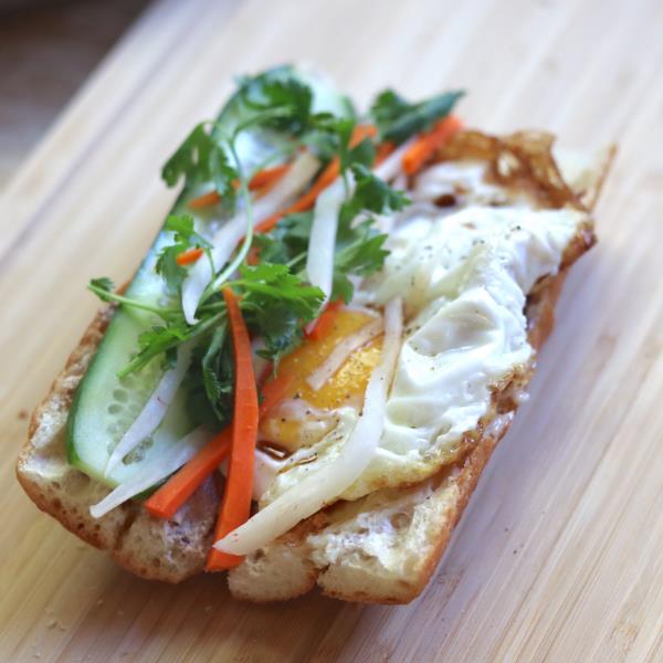 Fried eggs with house mayo, pickled carrots & daikon, cucumber, cilantro, jalapeno, and scallions. Banh Mi Trung (Fried Egg)