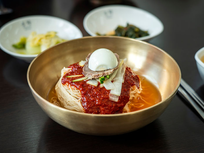 Chewy buckwheat noodles mixed with a spicy, sweet, and tangy gochujang sauce — bold, refreshing, and full of flavor. Spicy Cold Noodles