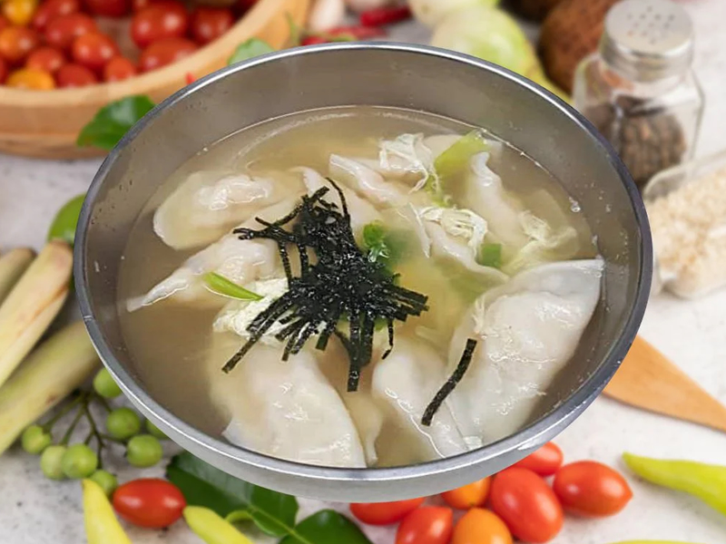 Korean dumpling soup with soft beef broth, egg, and sliced rice cakes — warm, savory, and comforting. Mandu Guk