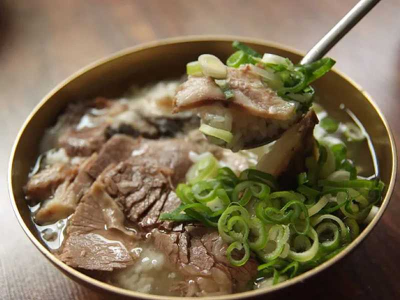 Classic Korean beef short rib soup simmered for rich flavor and tenderness. Served with sot-bap (Korean hot stone pot rice). Galbi Tang