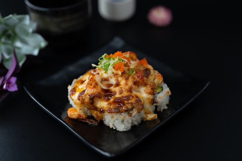 In: Avocado, Krabmeat | Out: Baked Crawfish, Mozzarella Cheese | Top: Eel Sauce, Masago, Green Onion
Baked Lobster