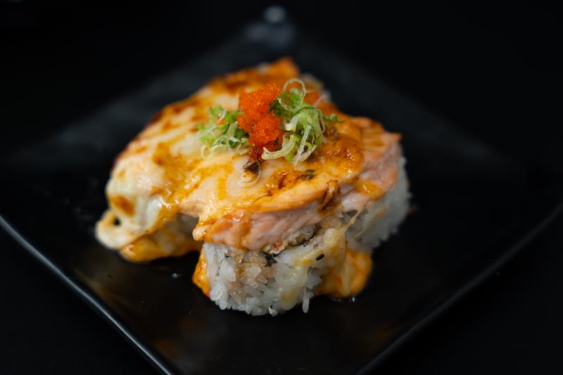 In: Avocado, Krabmeat | Out: Baked Salmon, Mozzarella Cheese | Top: Eel Sauce, Masago, Green Onion
Baked Salmon