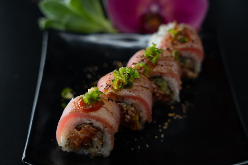 In: Sp. tuna, cucumber | Seared pepper tuna with chilli oil | Top: Sp. ponzu, chopped jalapeno, sriracha, green onion Falcon