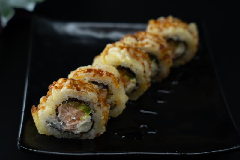 In: Avocado, cream cheese, salmon | Out: Fried | Top: Eel sauce Golden Phily
