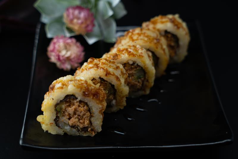 "In: Avocado, sp. tuna | Out: Fried | Top: Eel sauce
" Golden Spicy Tuna