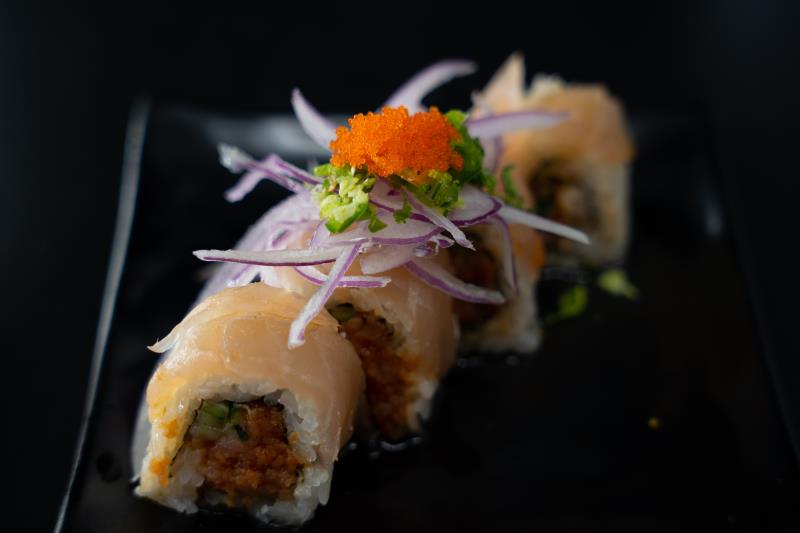 In: Sp. tuna, avocado, cilantro, asparagus | Yellowtail, albacore | Top: Sp. ponzu, red onion, chopped jalapeno, masago, green onion Omg