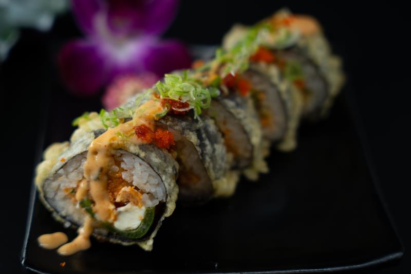 "In: Jalapeno, cream cheese, sp. albacore seaweed outside style | Out: Fried | Top: Eel sauce, sp. mayo, green onion, masago
" Quiet Fire