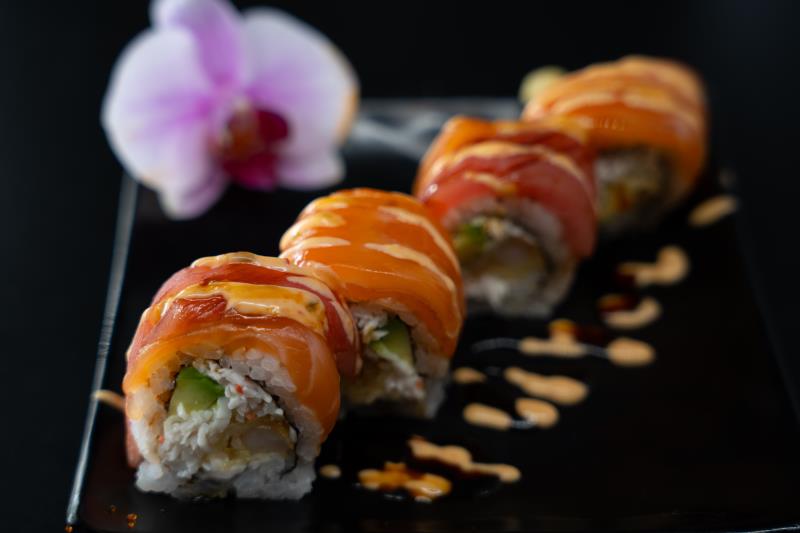 In: Shrimp tempura, krabmeat, avocado | Out: Tuna, salmon | Top: Sp. mayo, eel sauce Whispers Of The Sea