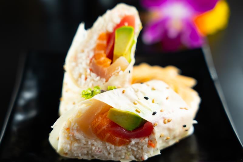In: Avocado, tuna, salmon, albacore, krabmeat on soy paper | Out: Diagonal cut | Top: Sp. mayo, eel sauce on the side Japanese Burrito (4 Pcs)