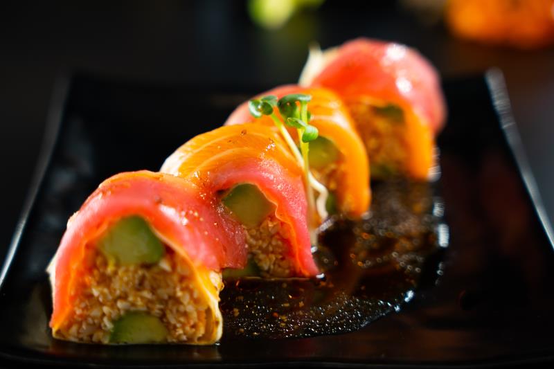 In: Avocado, sp. krabmeat wrapped with soy paper | Out: Tuna, salmon | Top: Mustard, chilli oil, kaiware Sugoi