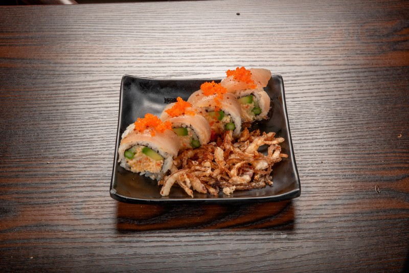 In: Sp. krabmeat, cucumber, avocado, asparagus | Out: Albacore | Top: Mustard dressing, crispy onion, masago Albacore Crispy Onion