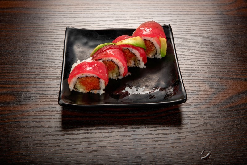 In: Sp. tuna, cucumber | Out: Tuna, avocado | Top: Mustard dressing, green onion Red Dragon