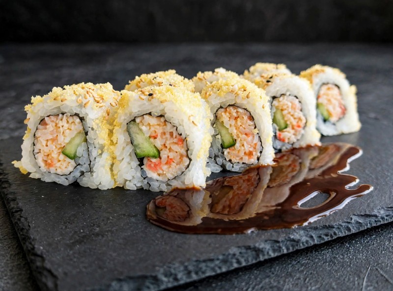 Crabmix, Spicy Tuna, Cucumber inside. Crunch bit on top. Eel Sauce. Crunch Roll