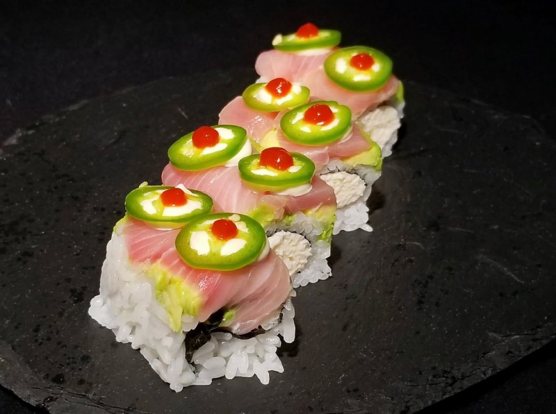 Crab, Jalapeno Garlic & Cucumber Topped w/ Avocado Yellowtail. Wasabi Mayo and Jalapeno. Amberjack Roll