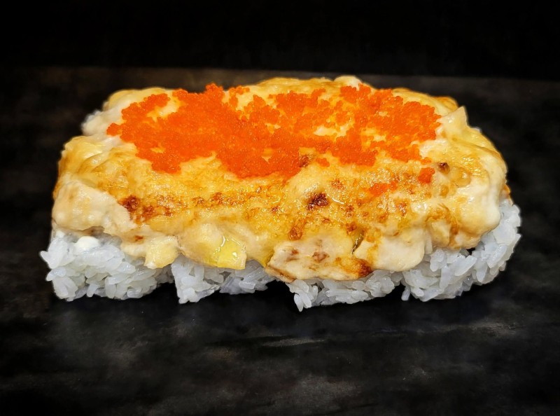 California Roll with Baked Scallop, Masago on top. Baked Scallop Cali Roll