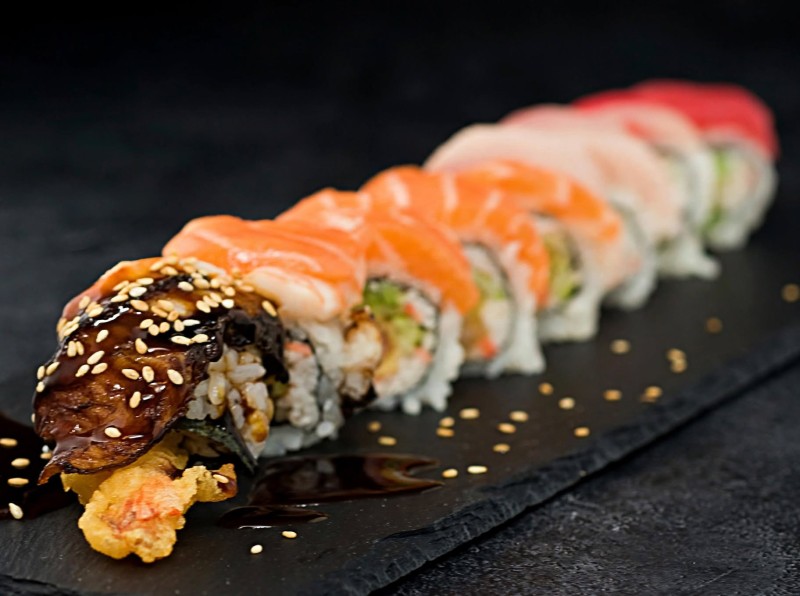 Shirmp Tempura, Cucumber, Crab inside. Tuna, Yellowtail, Salmon, White Fish, Shrimp, Avocado, Eel on top. Butterfly Roll