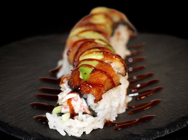Crab Mix, Cucumber inside. Eel, Avocado on top. Eel Sauce. Dragon Roll