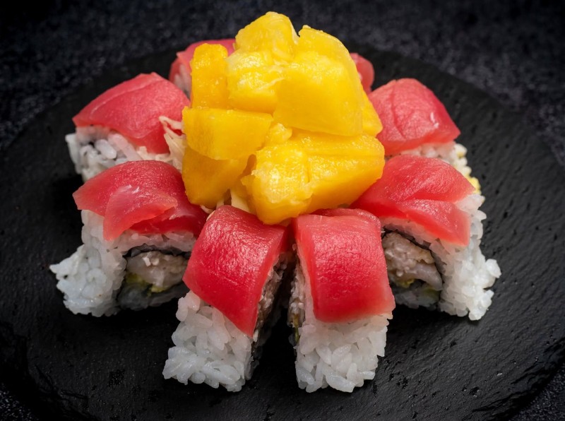 Crab Mix, White Tuna and Avocado topped with Tuna. Pokie Sauce Served with Cabbage Pineapple Salad. Hawaiian Pokie Roll