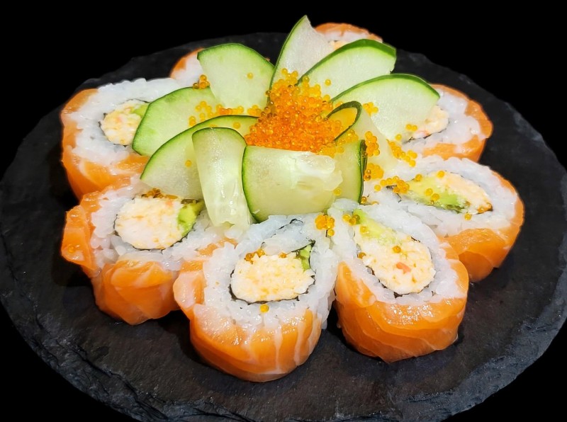 Spicy Crab Mix, Avocado Tobiko inside. Salmon on top. Salmon Lover