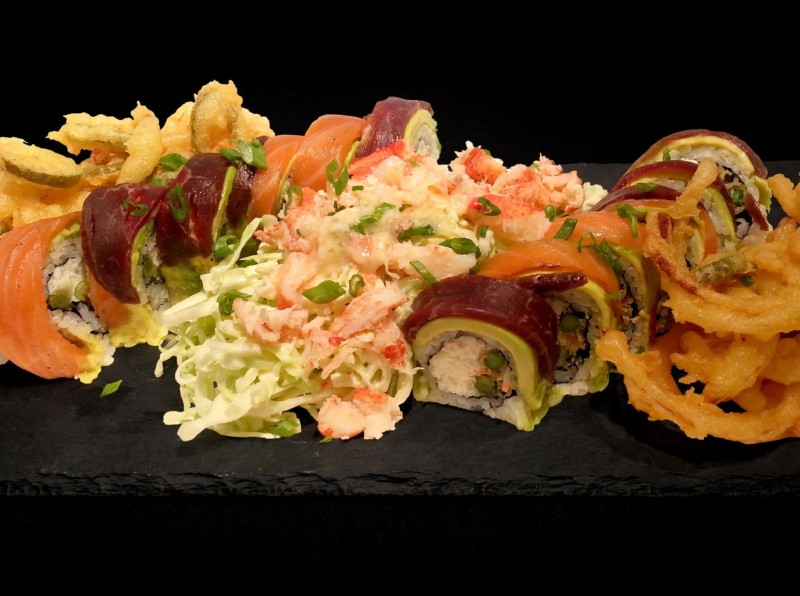 Smoked King Crab Mix, Tempura Green Onion topped with Smoke Salmon, Smoke Tenderloin Beef and Avocado. Seared with Lobster Cabbage Salad and Tempura Jalapeno and Onions. Smokey Deluxe Roll